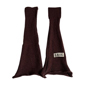 Deep brown ribbed knit leg warmers with flared fit and decorative logo patch