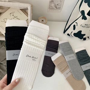 Detailed view of vertical ribbed texture on colorful cotton slouch socks in assorted colors
