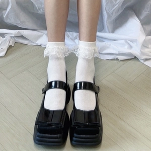 Mary Janes en cuir verni noir avec semelle plateforme et grand nœud décor