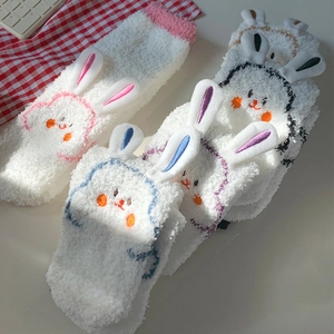 Detail of 3D plush bunny ears and cute embroidery on thick coral fleece winter socks