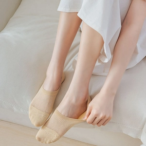 Close-up of beige breathable mesh boat socks with rib-knit texture for women