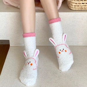 Thick white coral fleece socks for women featuring 3D rabbit ears and pink trim