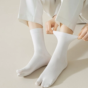 Japanese style white two-toe socks with ribbed cuffs shown in a high-elastic cotton fabric