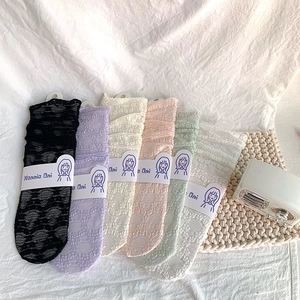 Japanese Lolita lace crew socks in six pastel colors featuring floral hollow patterns