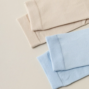 Close-up of fine ribbed knit fabric on Japanese style split toe tabi socks in soft pastels