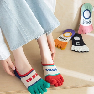 Detail of retro color-block five-toe no-show socks with vintage knitted patterns