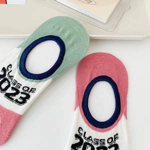 Close-up of low cut invisible five-finger socks featuring Class of 2023 knit text