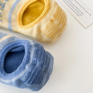 Detail of non-slip silicone heel strips on cotton invisible five-finger boat socks