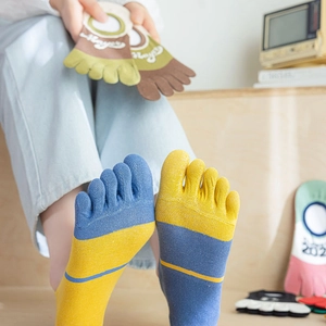 Detailed close-up of multi-color patchwork cotton five-toe socks with non-slip silicone heel