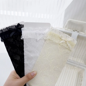Detail of lace trim and bow on breathable mesh calf socks in black, white and beige