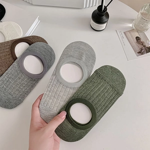 Detailed close-up of breathable mesh invisible boat socks in various natural colors