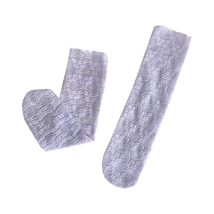 White floral lace slouch socks for women featuring hollow wave patterns and light mesh fabric