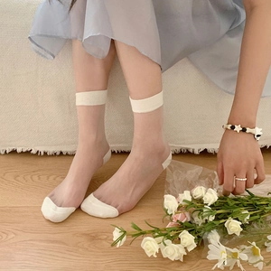 Sheer glass silk crew socks for women featuring reinforced white cotton heel and toe
