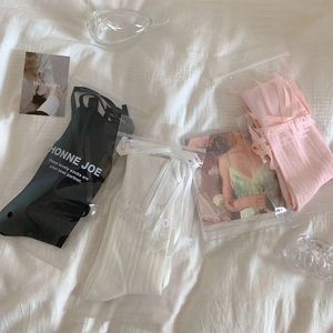 Three-pack ballet style bow socks in white, black, and pink with satin ribbons