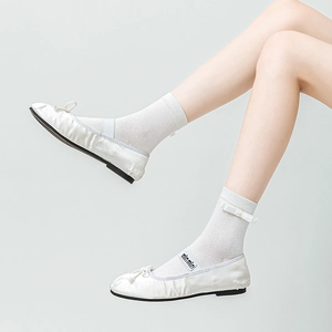 White satin ballet flats with bow and pearl bow mesh socks in minimalist style
