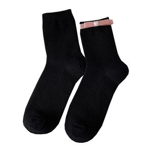Black mid-calf socks with pink satin bows and white heart pearls in ballet style