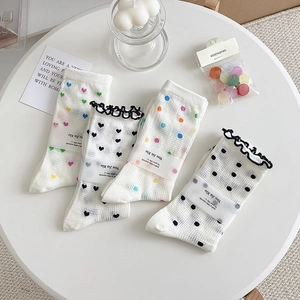 Set of four white mid-calf socks with colorful heart and polka dots and black lace edges