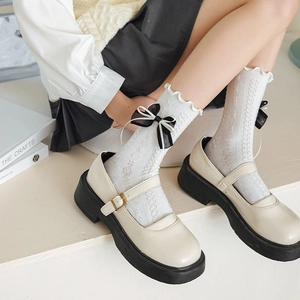 Detail of white Lolita socks with double-layered bows and vintage diamond hollow knit