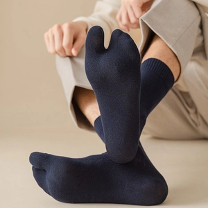 Detail of navy blue two-toe flip-flop socks showing breathable cotton knit texture