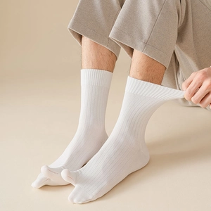 Detail of high elasticity cuff on white two-toe split socks with ribbed knit texture