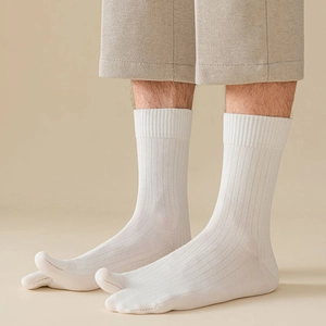 Detail view of white cotton-blend split toe socks with vertical ribbed texture for men