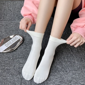 Classic white mid-calf cotton socks for women featuring high elasticity and breathable fabric