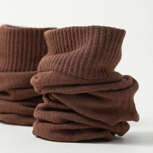 Macro view of brown ribbed knit fabric texture on men's two-toe flip-flop socks