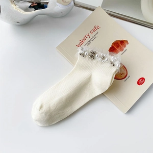 Sweet cream ankle socks featuring delicate white lace trim and handmade pearl accents