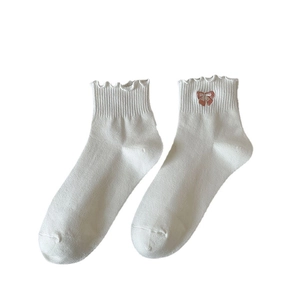 Chaussettes blanches en coton pour femmes avec bords à volants et broderie nœud rose