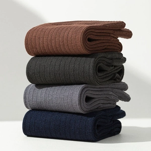 Close-up of ribbed texture on four pairs of men's two-toe socks in deep neutral colors