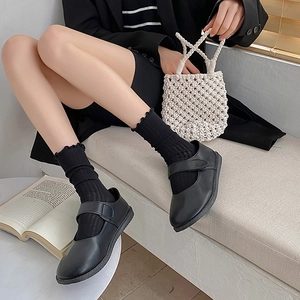 Japanese style black mesh ruffle socks paired with Mary Jane leather flat shoes
