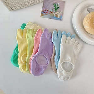 Macro detail of assorted pastel five-toe invisible socks with anti-slip silicone heels
