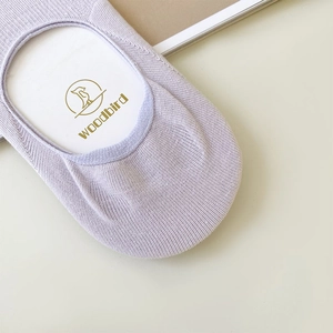 Close-up of light purple ribbed no-show cotton socks with anti-slip silicone feature