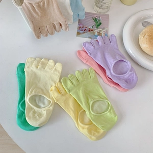 Detailed view of candy-colored five-finger invisible socks with open-top cutout design