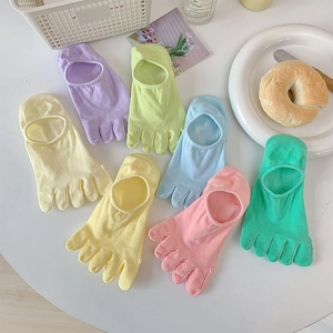 Detailed view of assorted candy-colored five-toe socks in breathable low-cut design