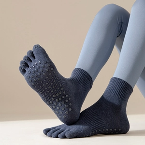 Non-slip five-toe yoga socks with silicone grips for pilates and indoor fitness