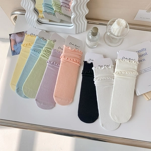 Detail of seven-color lettuce edge ruffled socks set with rib-knit texture and soft pastel hues