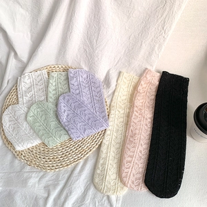 Detail of mesh lace socks showing leaf pattern texture in six soft pastel colors