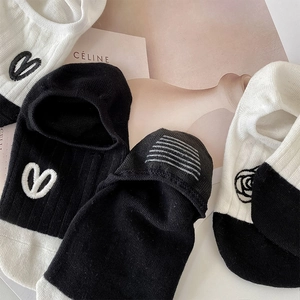 Detail of camellia embroidery and heart patterns on cotton invisible socks set