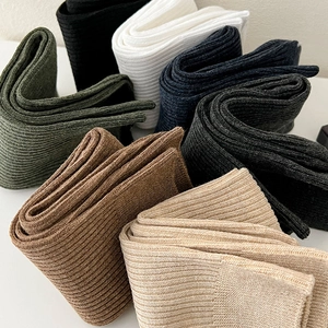 Detailed view of vertically ribbed cotton blend socks in a variety of classic colors