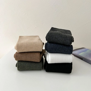 Detail view of cotton crew socks showing 7 colors and ribbed knitting texture