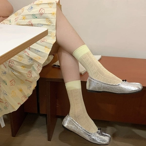 Lolita mesh calf socks with heart cut-outs paired with silver Tabi ballet flats