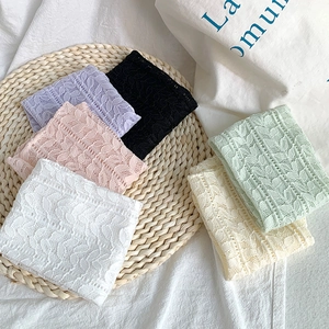Detailed view of breathable mesh lace socks in multiple colors with leaf patterns