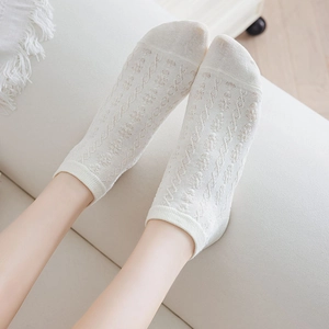 Japanese style white ankle socks for women featuring hollow knit floral jacquard patterns