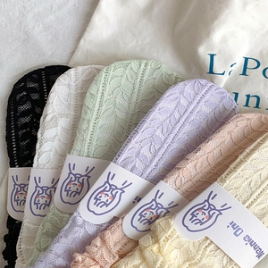 Detail of colorful mesh lace socks in various pastel colors with delicate woven texture