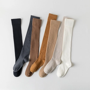 Knee-high socks in multiple colors including black and grey for autumn and winter