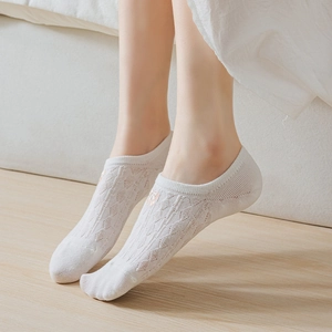 White low-cut boat socks with delicate lace hollow pattern and floral embroidery