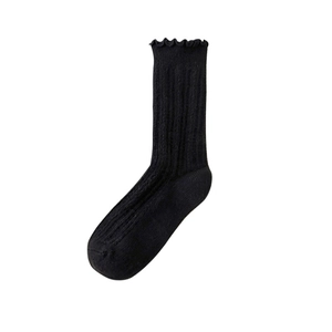 Classic black mid-calf socks with ruffle trim and vertical ribbed knit texture