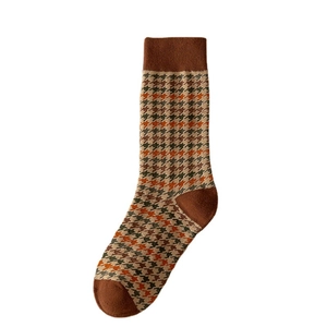 Retro houndstooth mid-calf socks in brown and orange tones for women in autumn