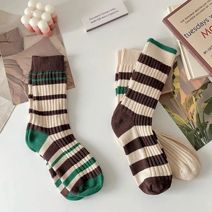 Retro striped mid-calf cotton socks in brown and cream colors with a soft knit texture